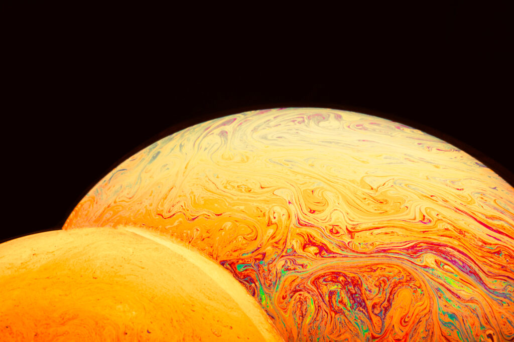 gradient varicolored soap bubbles black background