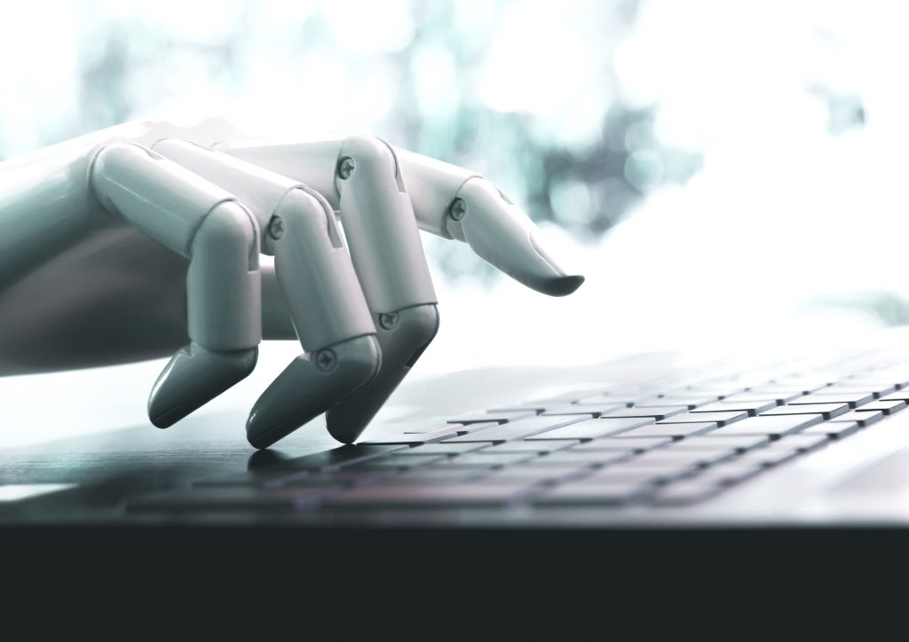 robot concept or robot hand chatbot pressing computer keyboard enter